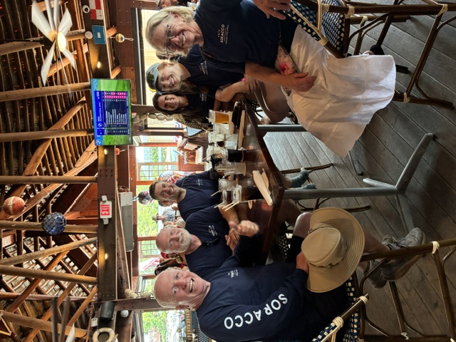 Campaign volunteers in Soracco shirts gathered around a table for lunch at Port Royale Marina