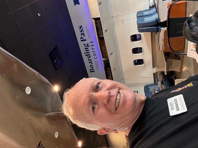 Scott Soracco enjoying a coffee on the Gainesville square at Boarding Pass Cafe